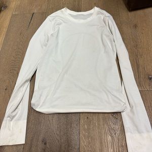 This is a white long sleeve swiftly tech from lululemon in a size 2